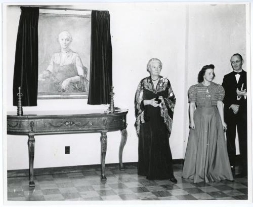 Anna B. Lawther standing next to her portrait at Lawther Hall dedication ceremony