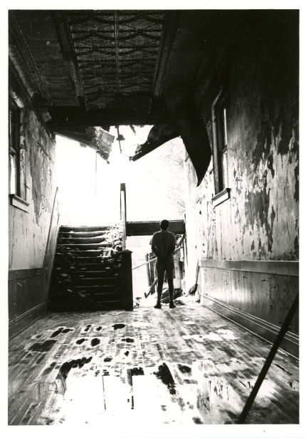 Person in hallway damaged by fire and water