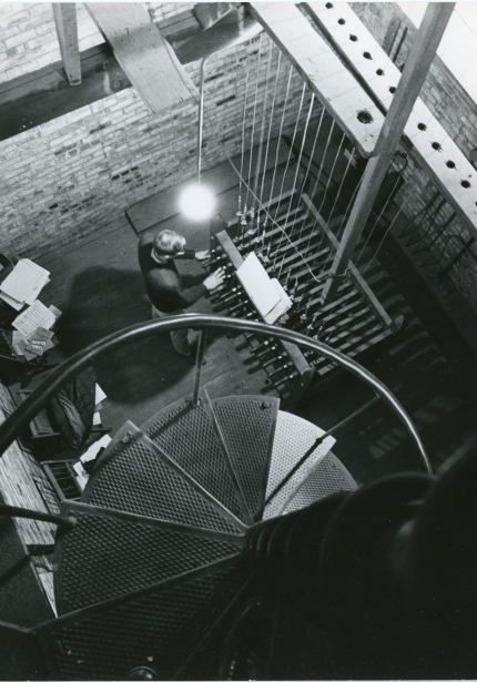 Carilloneur playing keyboard, taken from belfry