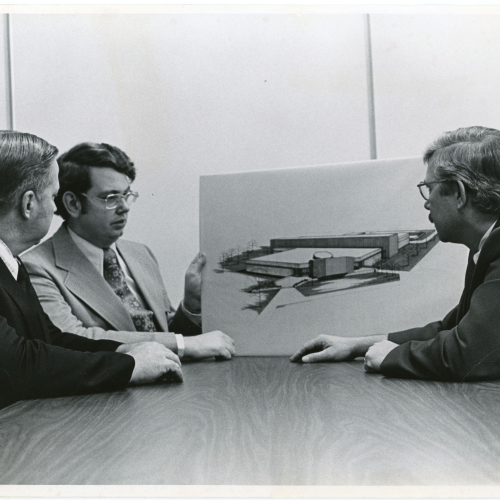 Leland Thompson, Geoffrey Grimes, and Alvin Rudsill with plans for the Industrial Technology Center