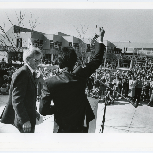 William Lew accepting the building keys from John Page at Kamerick opening ceremony