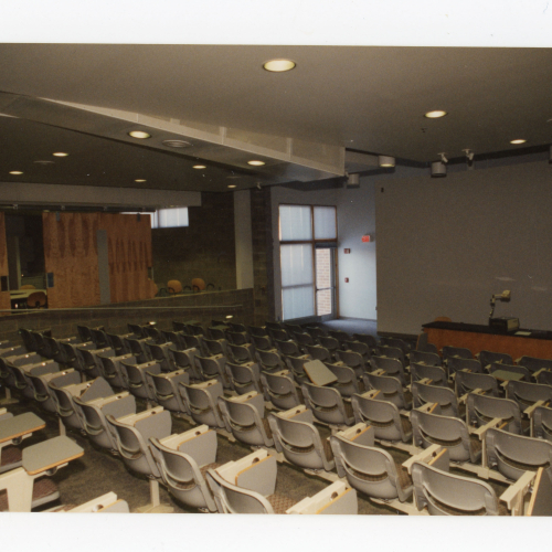 Sloped lecture hall taken from the back looking down to the front