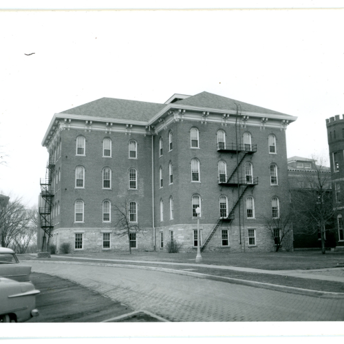 Brick building with two exterior fire escapes visible