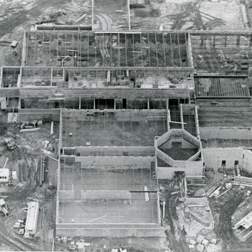 Taken from above, foundations and framing of a multi-part building under construction