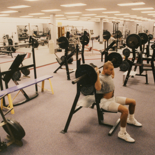 Man using equipment in a weight room