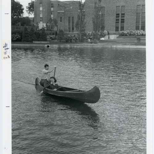 Two students canoeing on Prexy's Pond
