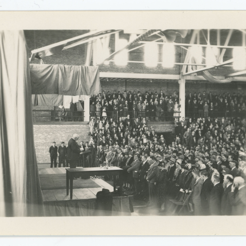 Man addressing crowd in West Gym