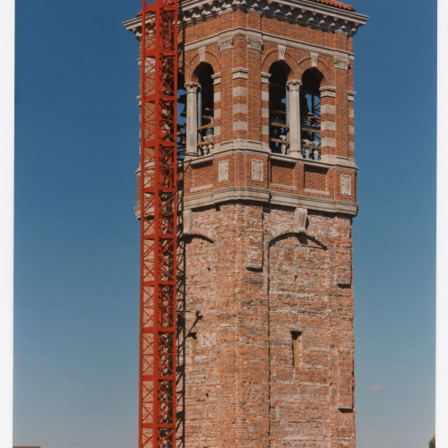Brick and scaffolding on Campanile's upper half