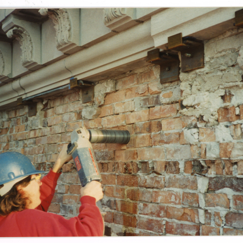 Mason drilling a core in Campanile