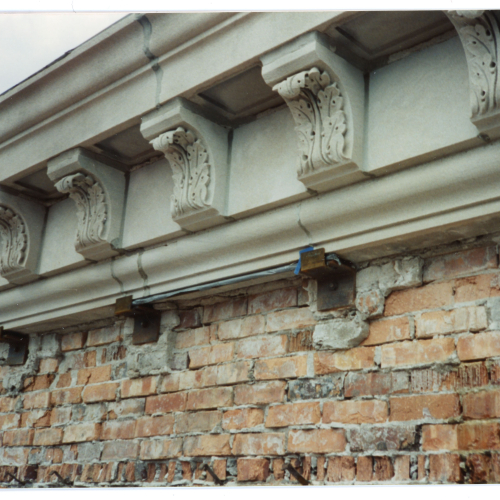 Limestone and brick damage near top of Campanile