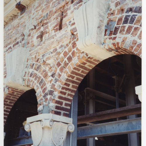 Damaged trim and brick near Campanile belfry