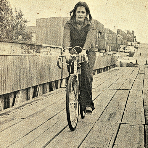 Cyclist on pedestrian and bicycle bridge to Hillside Courts