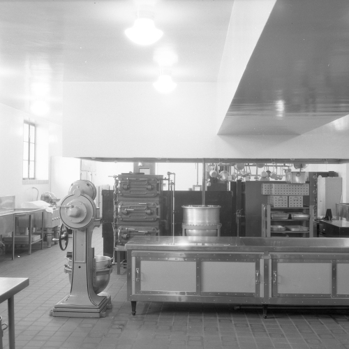 Empty kitchen with industrial preparation equipment