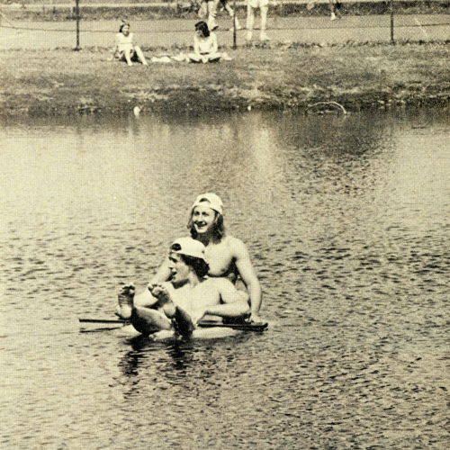 Two students cooling off in Prexy’s Pond